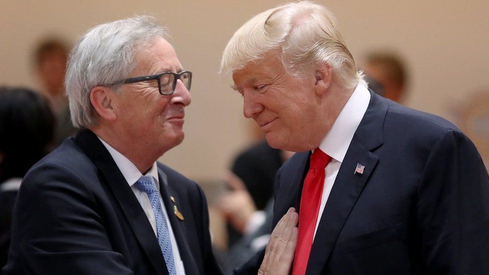 President Donald Trump (R) and President of the European Commission Jean-Claude Juncker chat prior to the morning working session on the second day of the G20 economic summit on July 8, 2017 in Hamburg, Germany