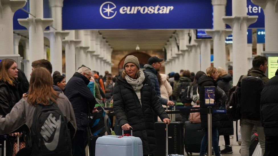 Passengers at the entrance to Eurostar in St Pancras International station