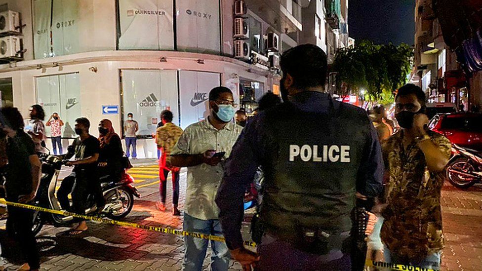Police secure a site after a suspected bomb blast injured former Maldives president