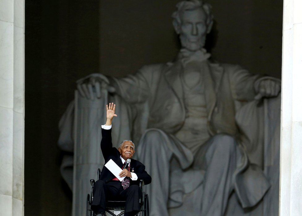 Joseph Lowery waves after his speech at the Lincoln Memorial during the 50th anniversary ceremonies of the 1963 March on Washington, 28 August 2013