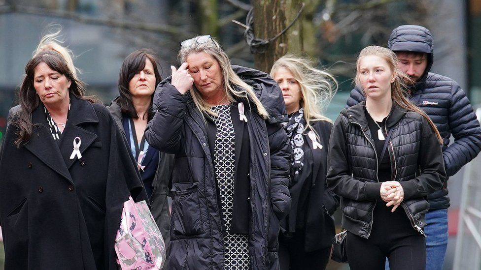 Cheryl Korbel (centre) mother of nine-year-old Olivia Pratt-Korbel, arrives with family members at Manchester Crown Court for the trial of Thomas Cashman, who is charged with murdering her daughter