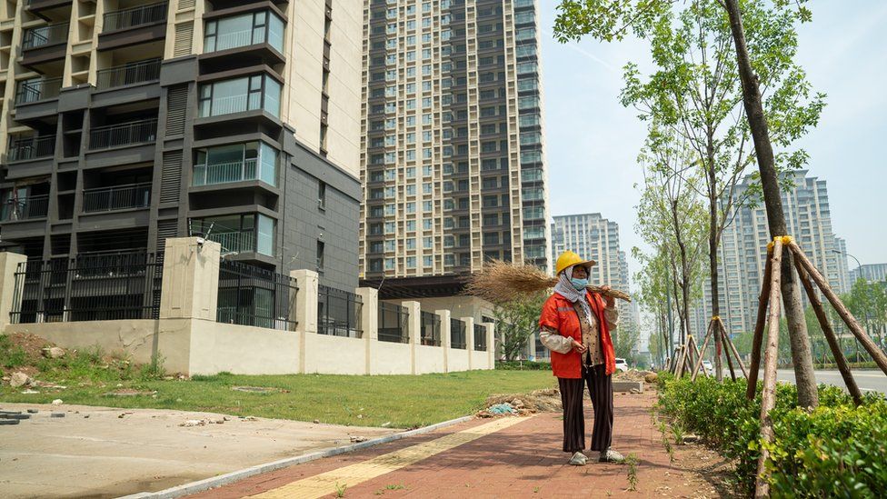 A woman working as a street cleaner in China