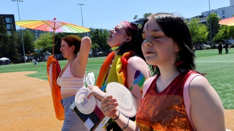 People take part in a Pride rally in Seattle