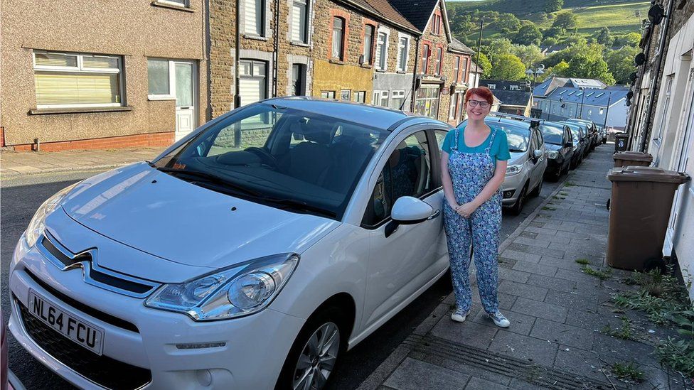 Emma Lamorte stood next to her car after she passed her test