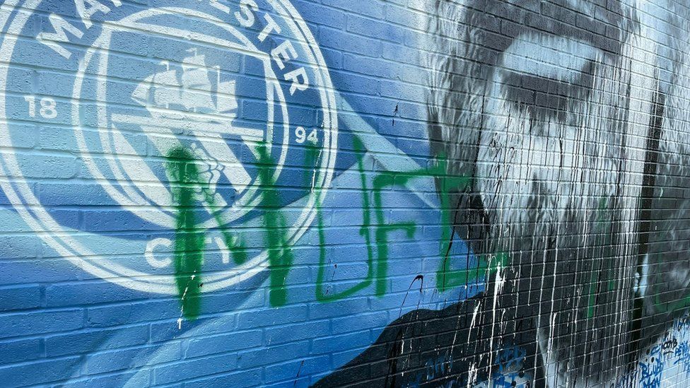 Defaced UK soccer star mural transformed into symbol of anti