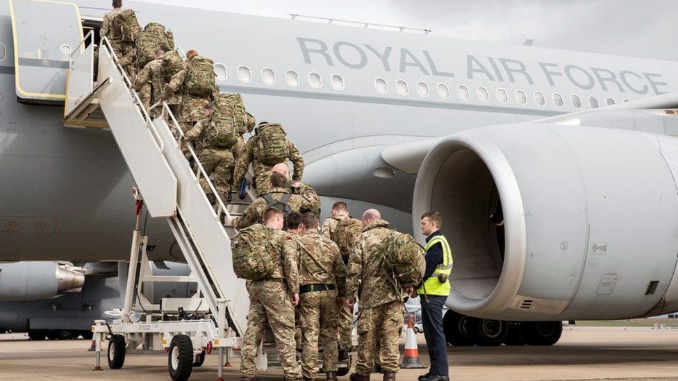 Troops board RAF transport aircraft