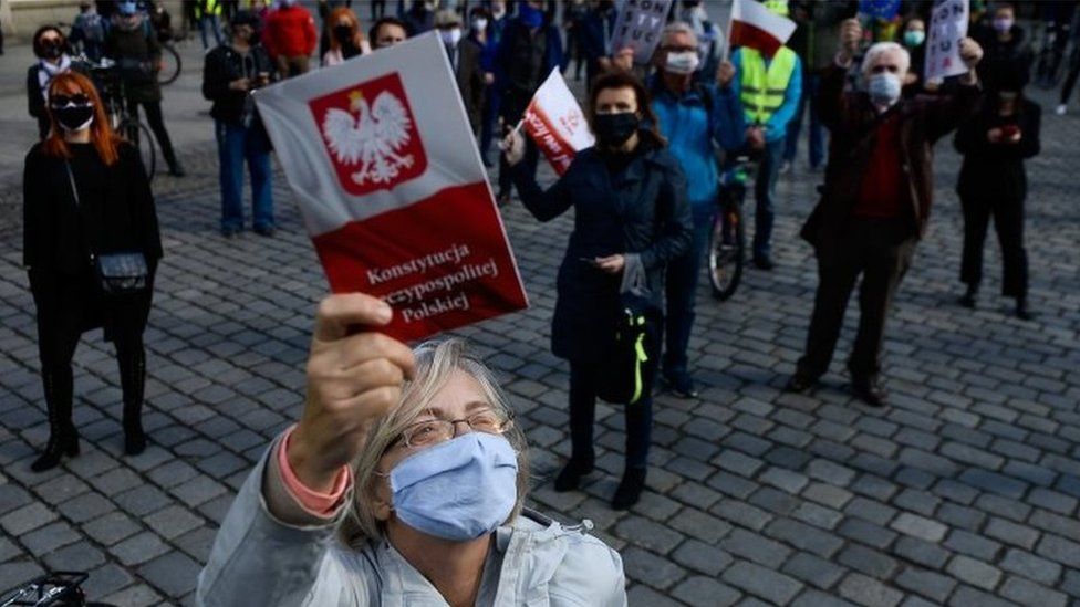 People wearing masks at a rally in Wroclaw, Poland, calling for the postponement of the presidential election. Photo: 3 May 2020