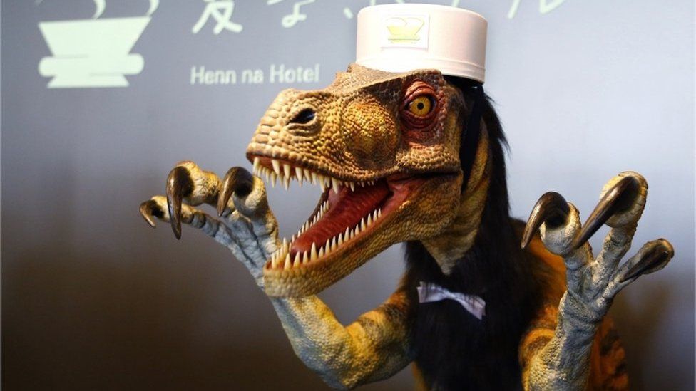 A receptionist dinosaur robot performs at the new robot hotel, aptly called Henn na Hotel or Weird Hotel, in Sasebo, southwestern Japan, Wednesday, 15 July 2015.