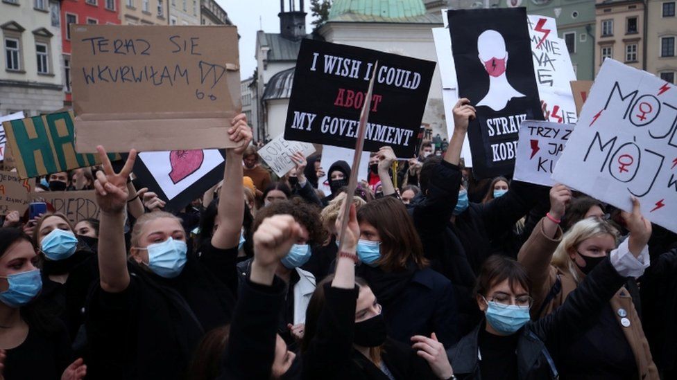 Demonstrators hold a protest against a court's near-total ban on abortion in Poland