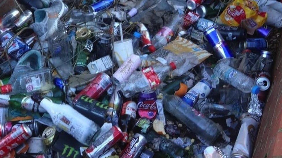 Big pile of bottles, cans and litter