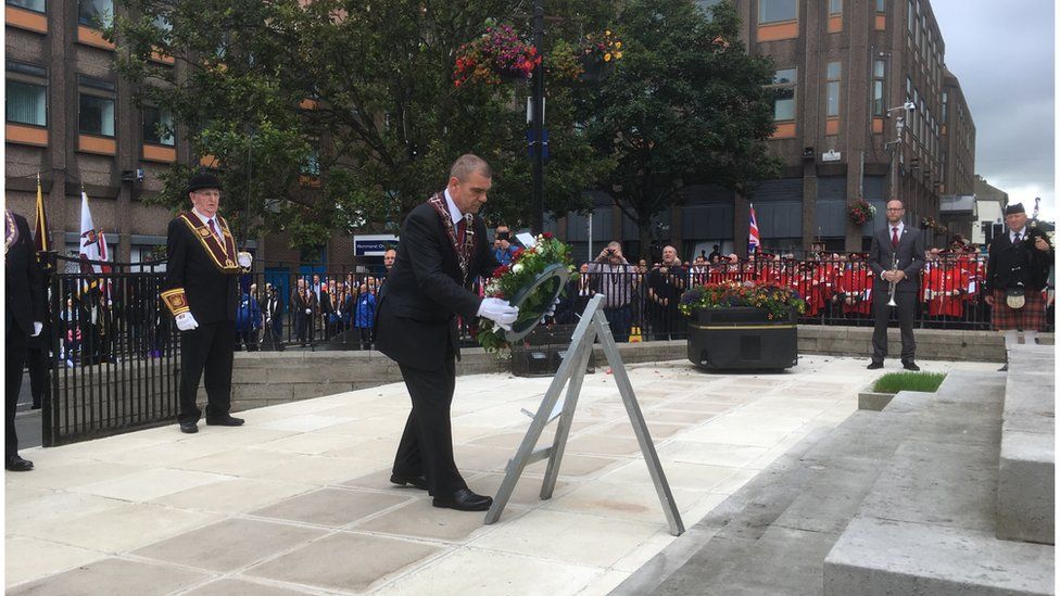 Governor of the Apprentice Boys, Graeme Stenhouse, lays a wreath at the cenotaph in Derry on Saturday