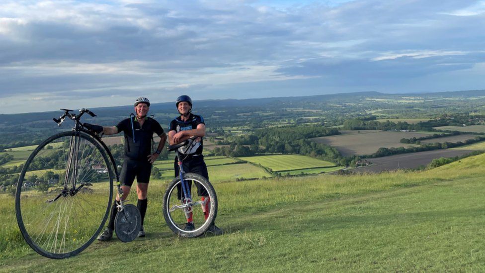 Penny farthing and unicycle riders take on South Downs BBC News