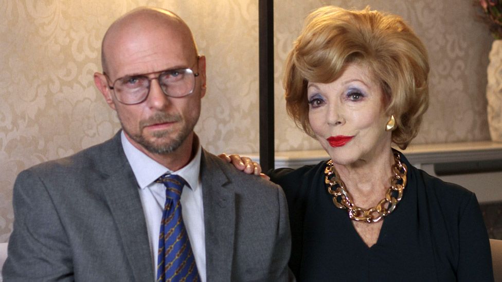 Luke Goss and Dame Joan Collins in The Loss Adjuster