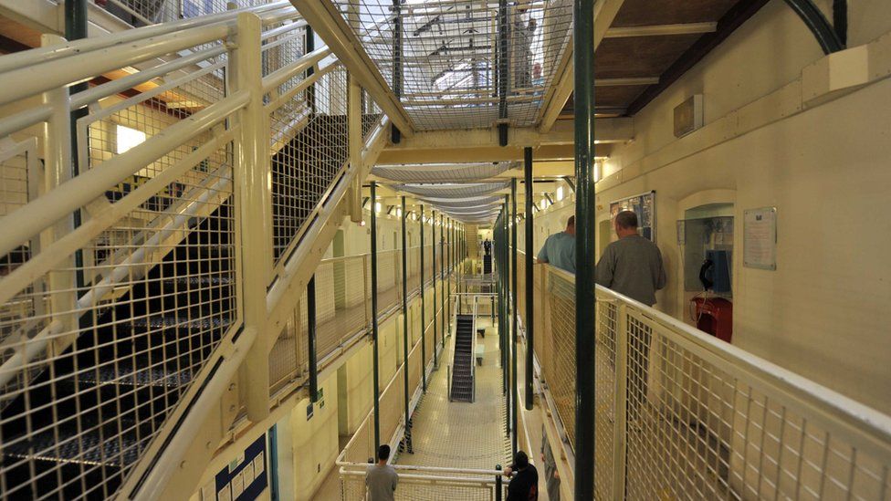 Prisoners in a cell block at Wormwood Scrubs
