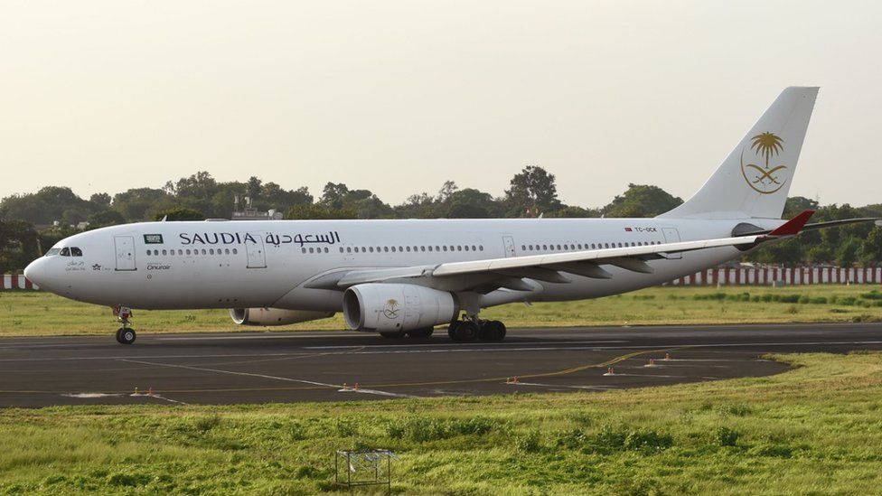 A Saudi Arabia Airlines plane on the runway