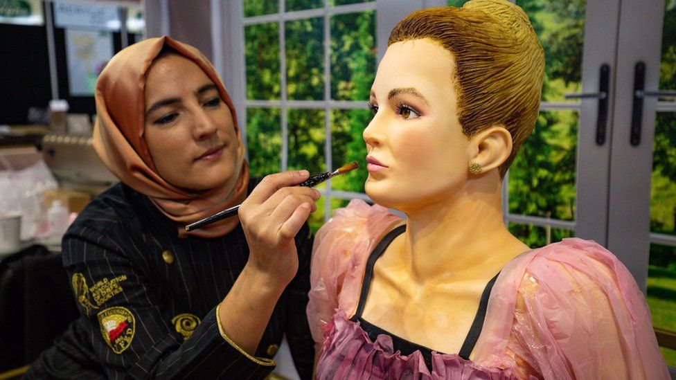 Tuba Geckil adding the finishing touches to her life-size creation of Villanelle from BBC drama "Killing Eve", on display during Cake International 2019 at the NEC, Birmingham