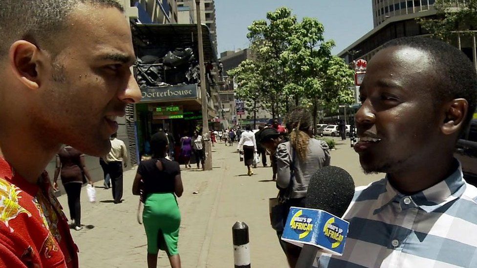 Ikenna Azuike interviewing someone in Kenya