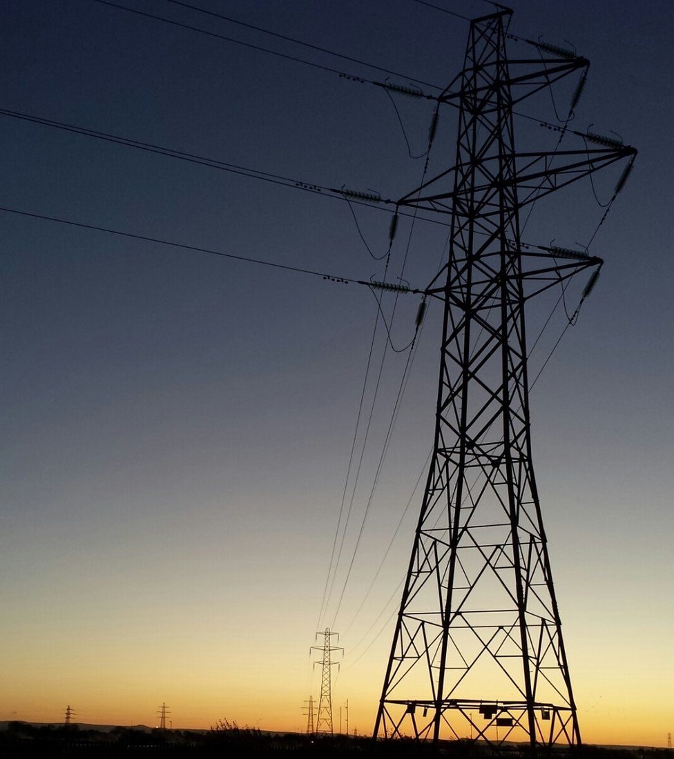 Electricity pylons at sunrise