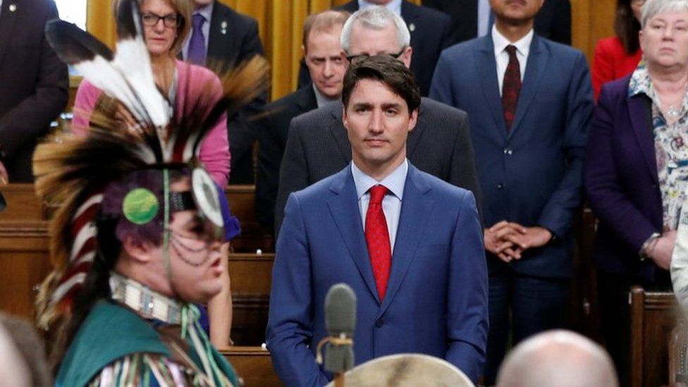 Canada"s Prime Minister Justin Trudeau listens to a drummer after delivering a statement of exoneration to the Tsilhqot"in Nation and the descendants of six Tsilhqot"in Chiefs in the House of Commons on Parliament Hill in Ottawa, Ontario, Canada on 26 March 2018.