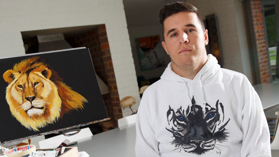 Henry Fraser, ex-rugby player who was paralysed from the neck down in an accident and now paints with his mouth, poses for a portrait at his home in Chipperfield on October 11th 2017 in Hertfordshire, England