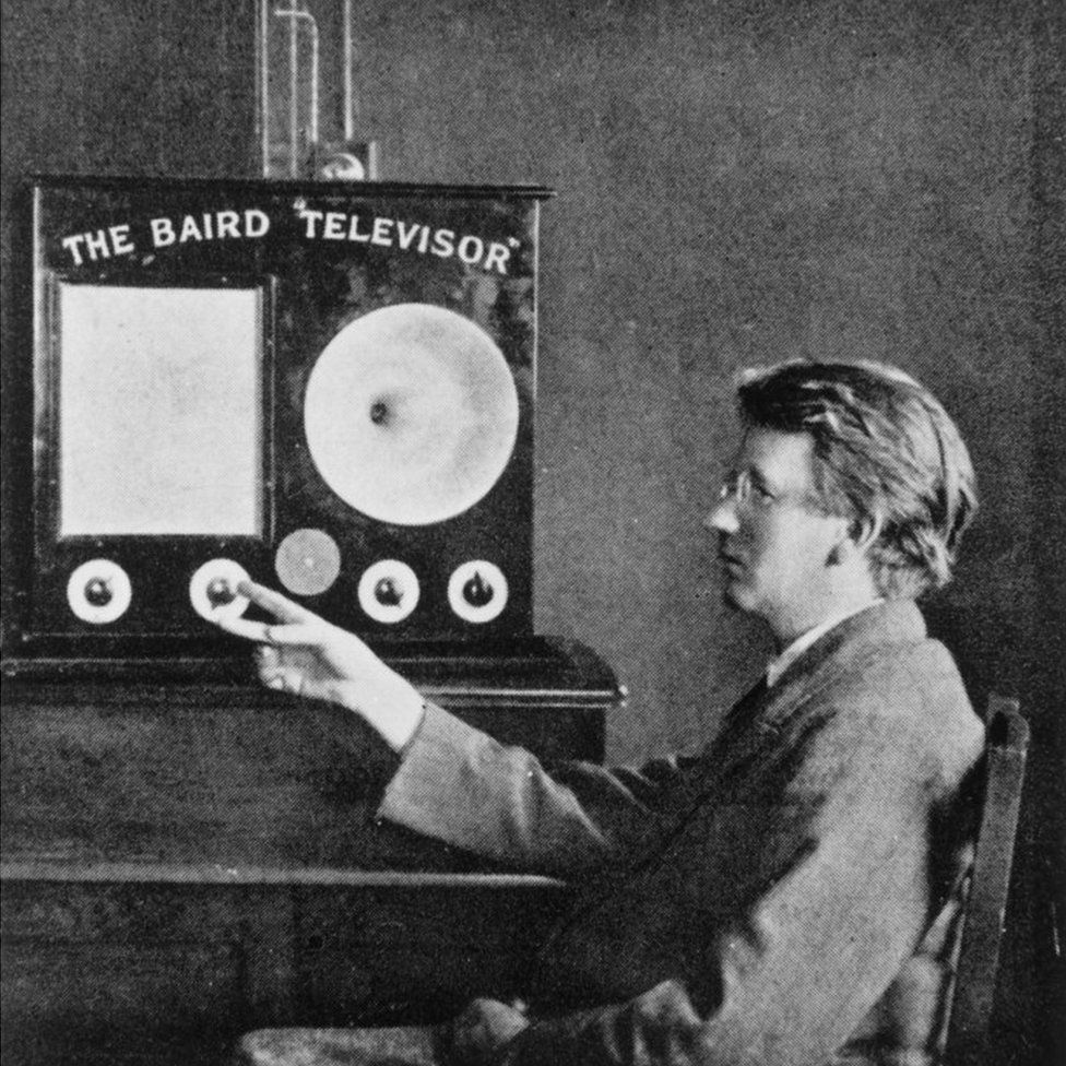 John Logie Baird with his invention, the "Televisor"