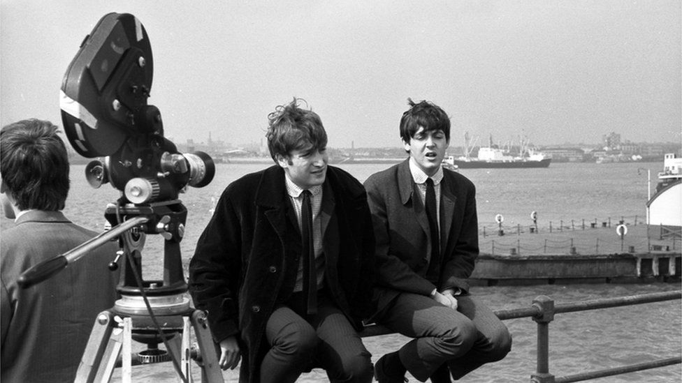 John Lennon and Paul McCartney at the Liverpool waterfront