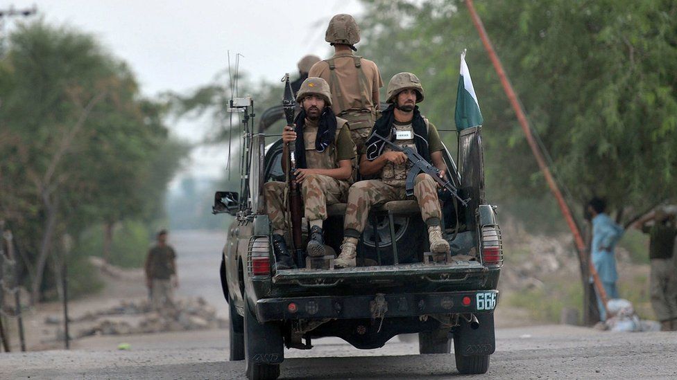 Pakistani troops patrol in the village of Ghundai in Khyber tribal district on July 18, 2014