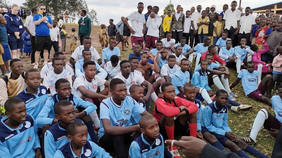 Young Rwandan footballers in their Heart of Midlothian strips ahead of a coaching session.