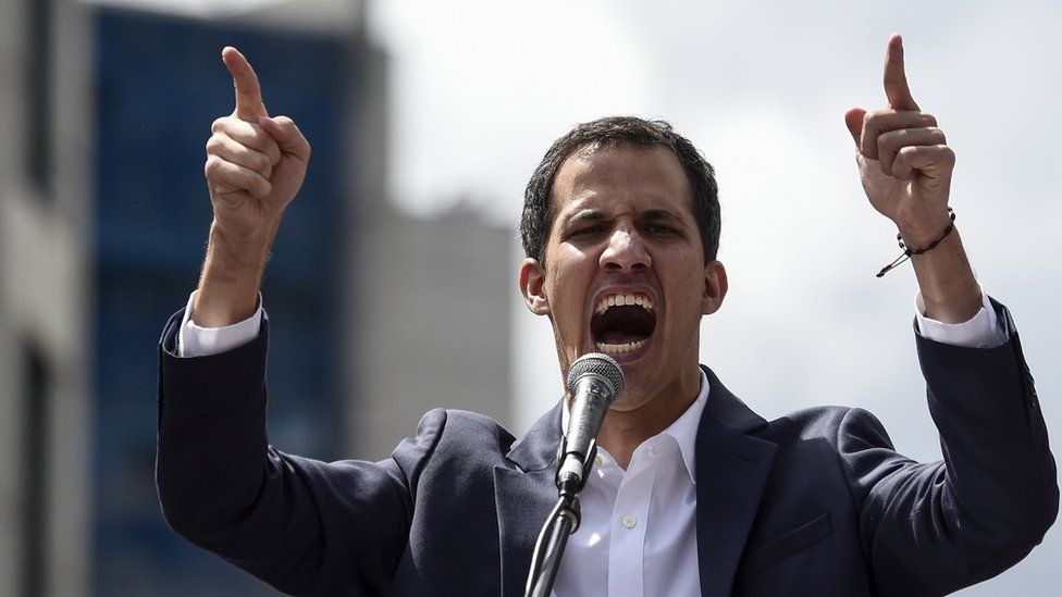 Venezuela"s National Assembly head Juan Guaido speaks to the crowd during a mass opposition rally