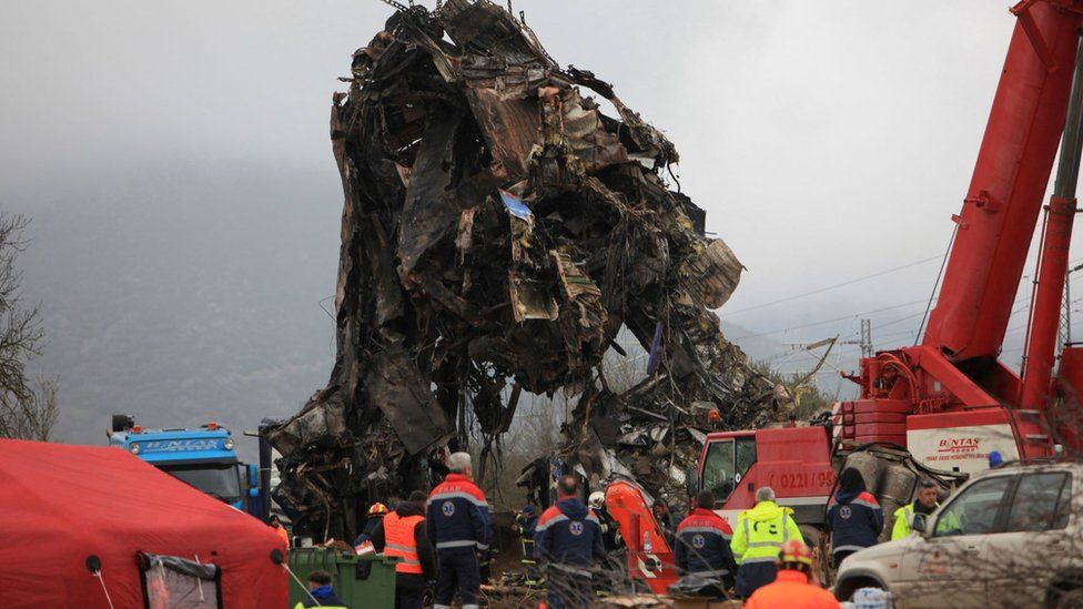 Remains of destroyed train carriage being removed by crane on Thursday morning