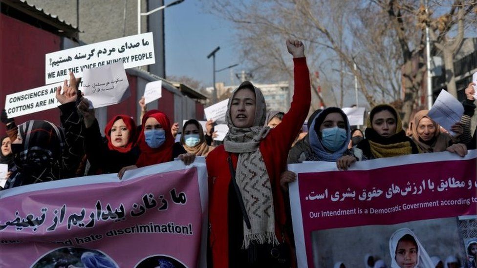Afghan women shout slogans during a rally to protest against what the protesters say is Taliban restrictions on women, in Kabul, Afghanistan, December 28, 2021.
