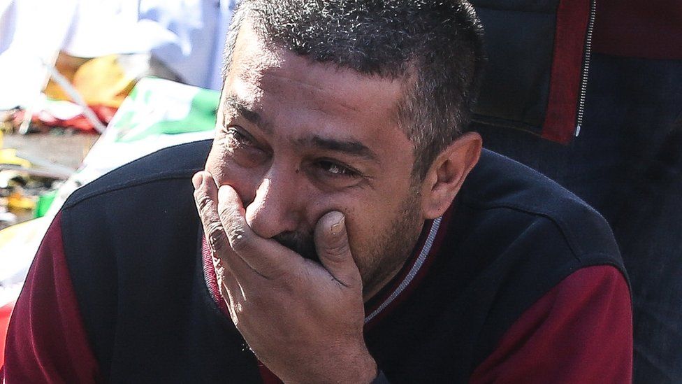 A man cries at the scene of explosions in Ankara, Turkey, Saturday 10 October 2015
