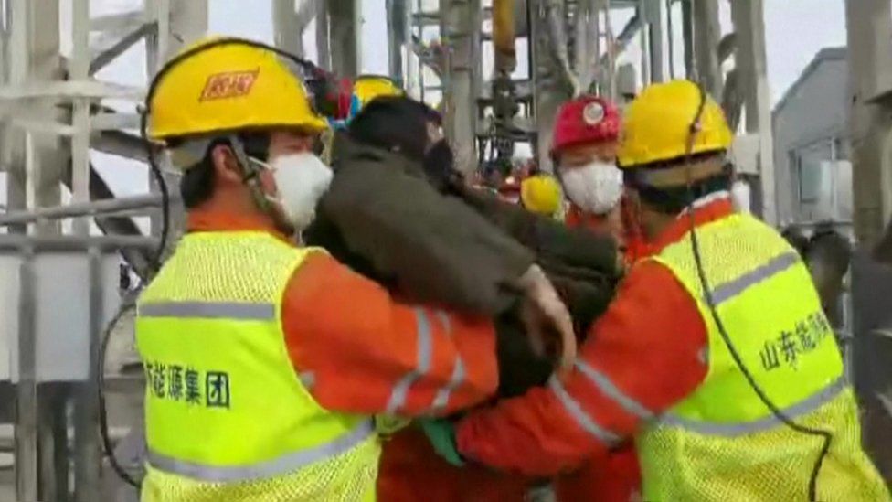 First miner being brought to surface by rescue workers