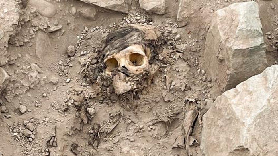 The remains of a mummy, believed to be from the Manchay culture which developed in the valleys of Lima between 1,500 and 1,000 BCE, are pictured at the excavation site of a pre-Hispanic burial, in Lima, Peru June 14, 2023.