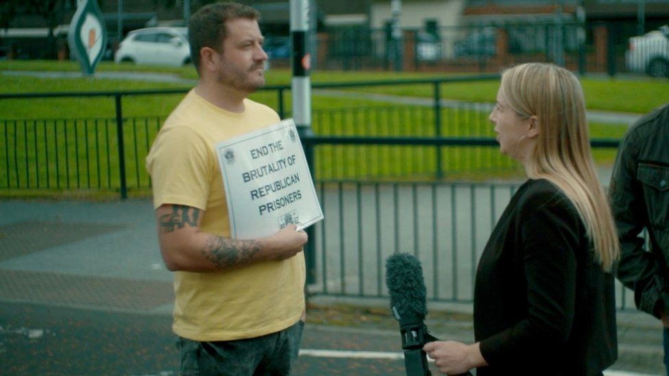 Emma Vardy questions a protester at a picket line