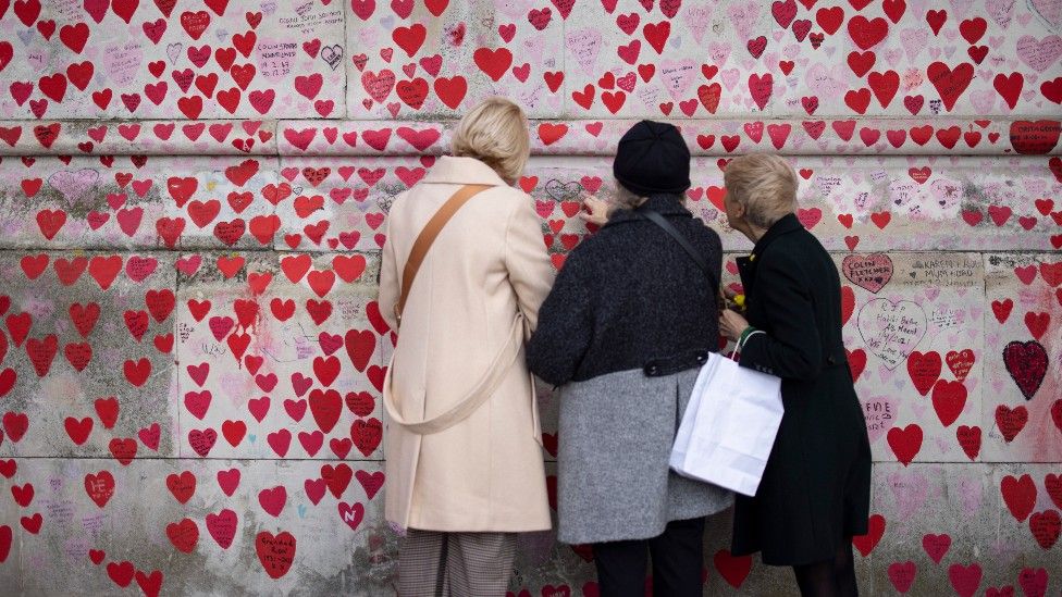 People continue visit the wall to pay their respects to lives lost in the pandemic