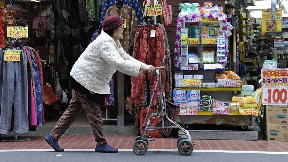 An elderly woman using a walker in Japan