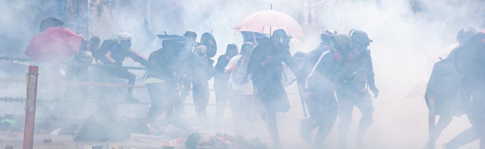 Protesters amid tear gas during the Hong Kong Polytechnic University demonstration