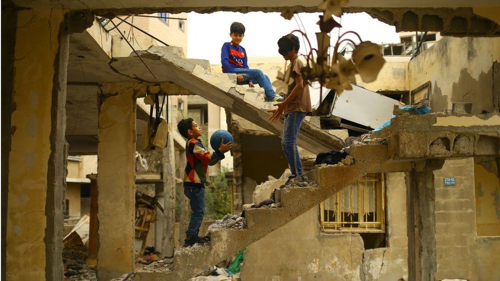 Children play in bomb-damaged building in Gaza City (April 2017)