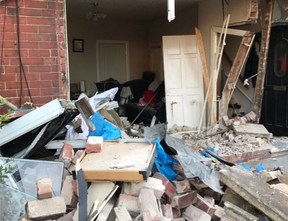 Two charged after car hit houses in Middlesbrough - BBC News