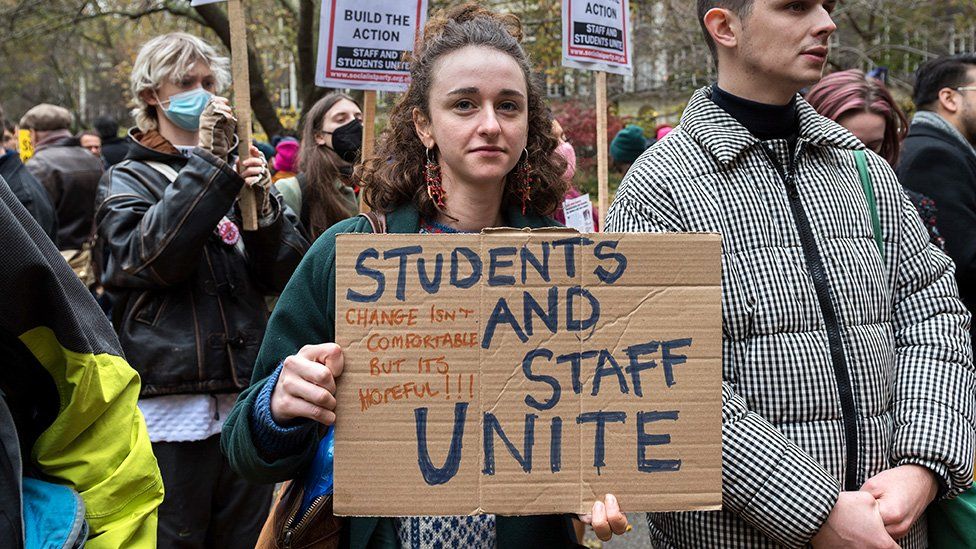Student at a university staff strike picket line