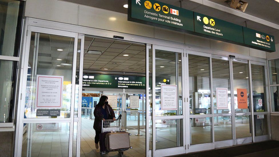 Passengers leave after taking the Covid-19 test at Vancouver International Airport in Vancouver, British Columbia, Canada, in February 2021