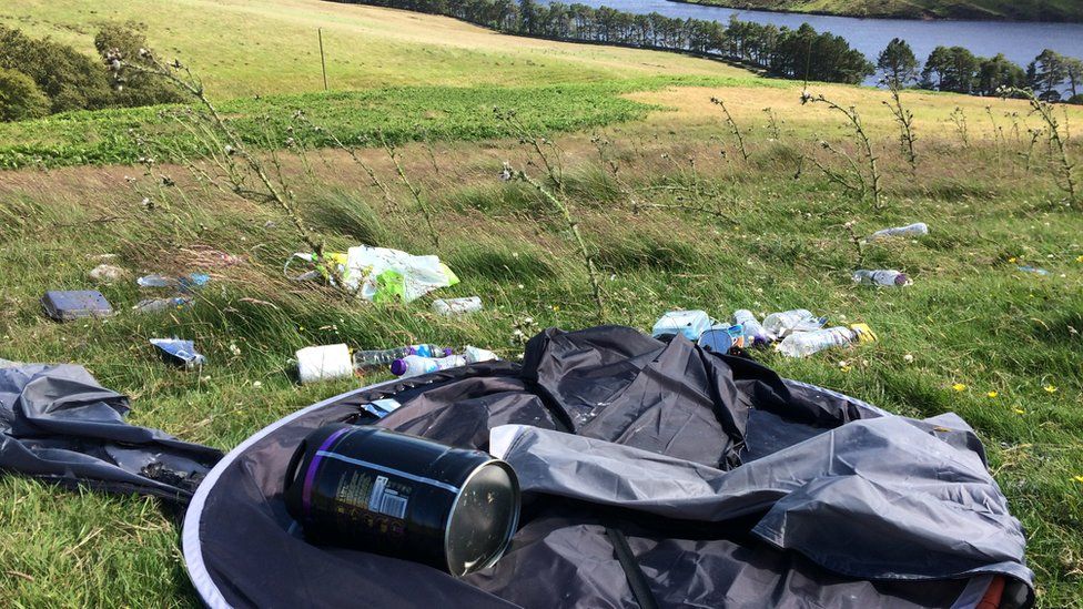 An abandoned tent and rubbish on Harbour Hill in the Pentlands