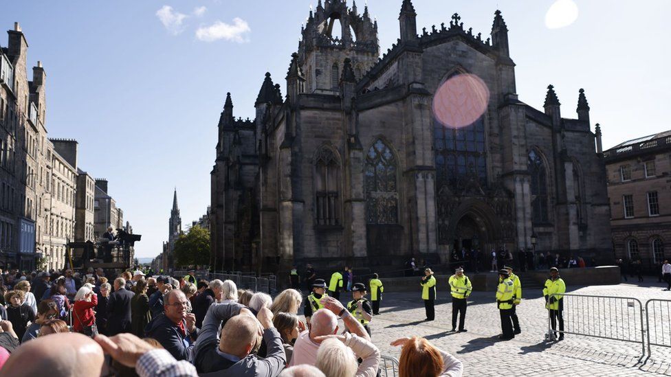 People queue to enter St Giles' Cathedral and pay respects to the late Queen Elizabeth in Edinburgh