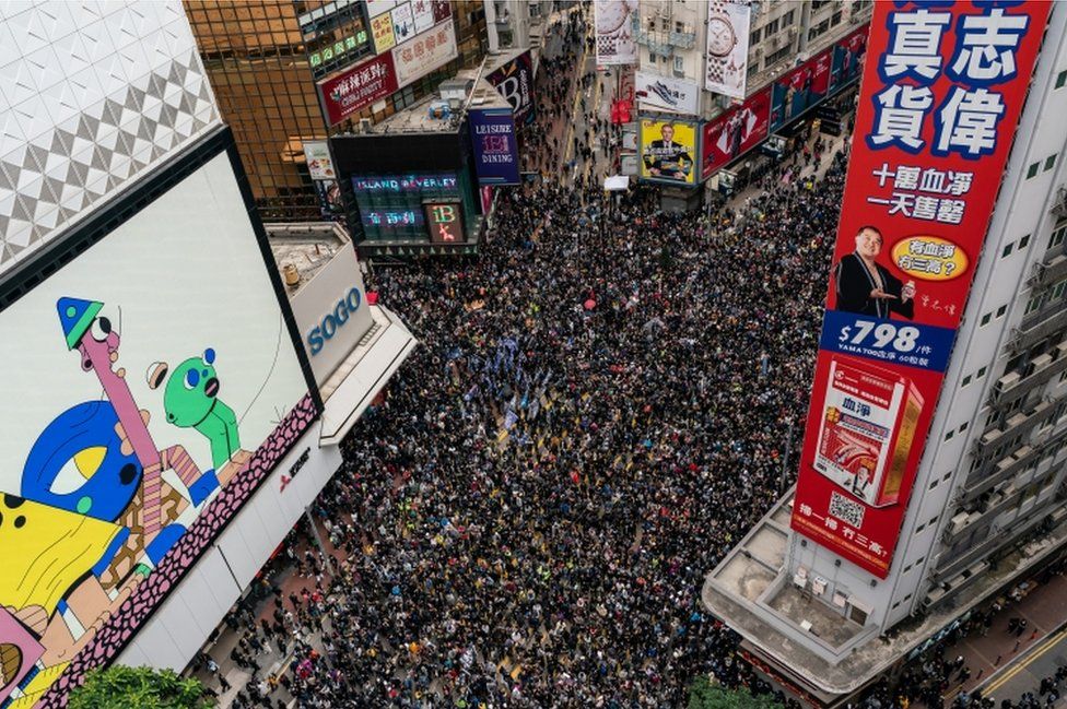 An aerial shot shows thousands of protesters filling a street for a rally on New Year's Day in Hong Kong