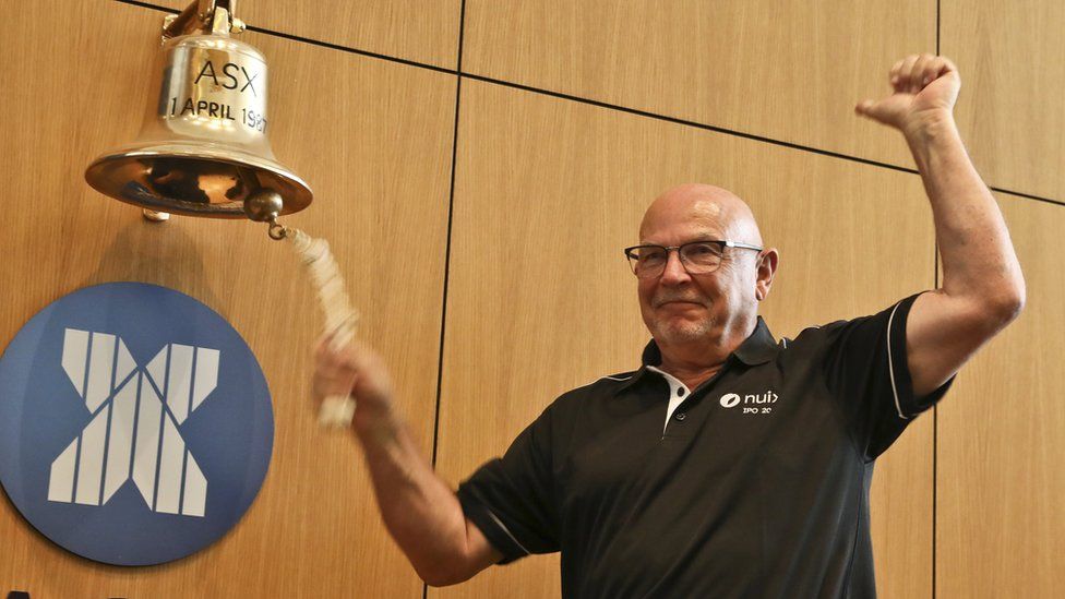 Rod Vawdrey ringing a bell at the Australian Stock Exchange