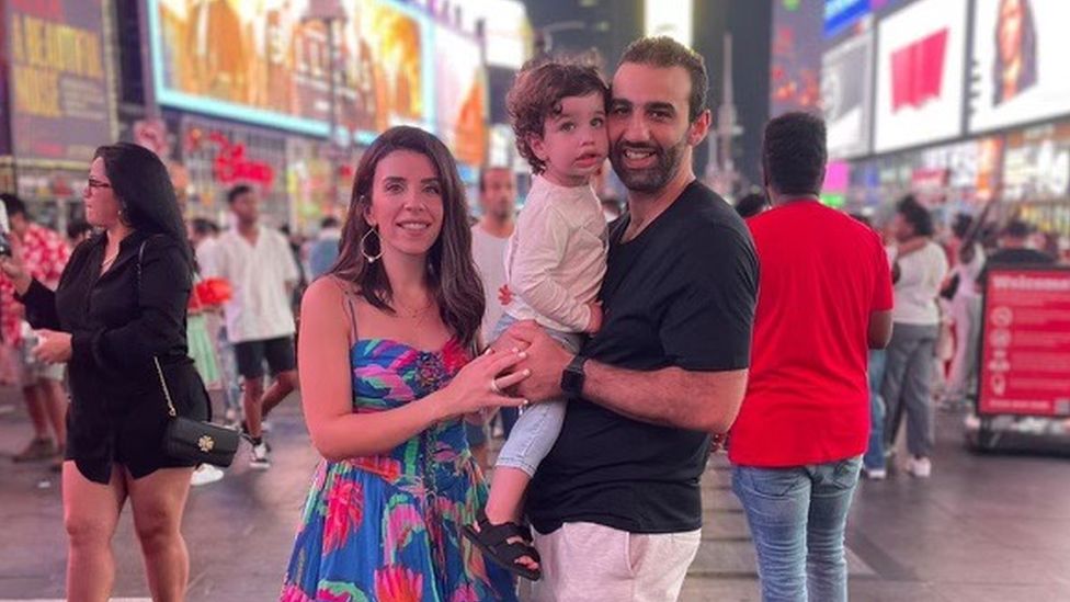 Wafaa Abouyzada, Abood Okal and their son, Yousef, in Times Square