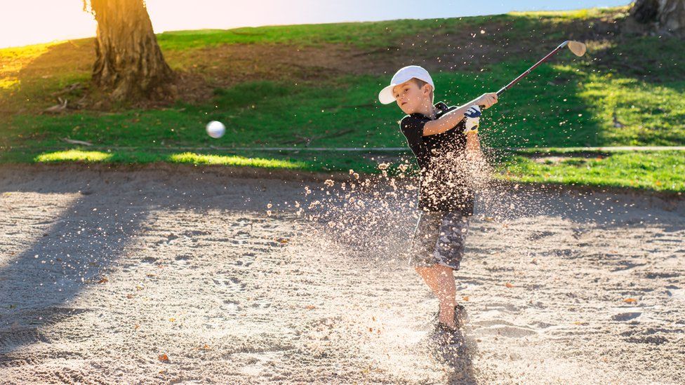 Child playing golf
