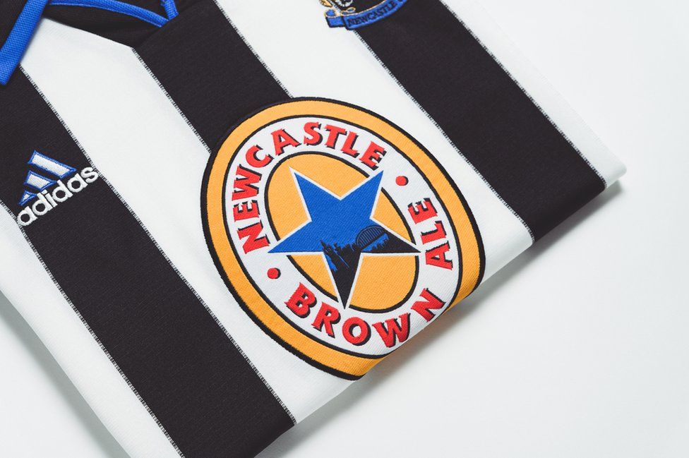A 1990s Newcastle United shirt showing the Newcastle Brown Ale sponsorship logo