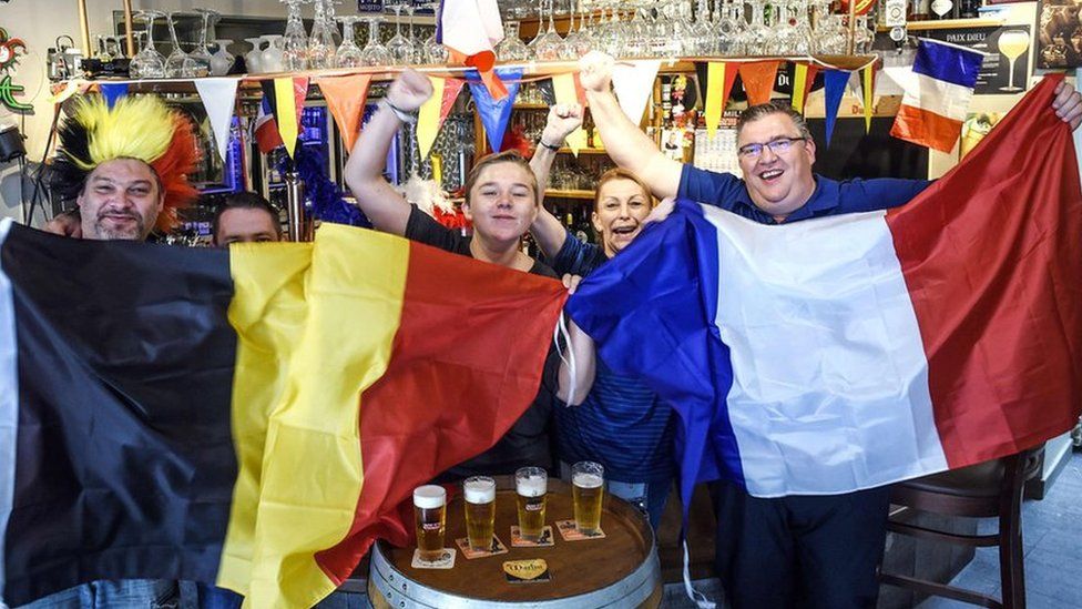 Belgian and French supporters gather at a cafe on July 9, 2018 near the French-Belgian border